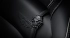 tourbillon with three flying bridges on aston martin seat